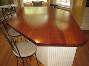 Sapele mahogany custom wood countertop, 1.75” thick, eased edge. Waterlox finish. This wood kitchen countertop was Installed near Lake Norma in Mooresville, NC.